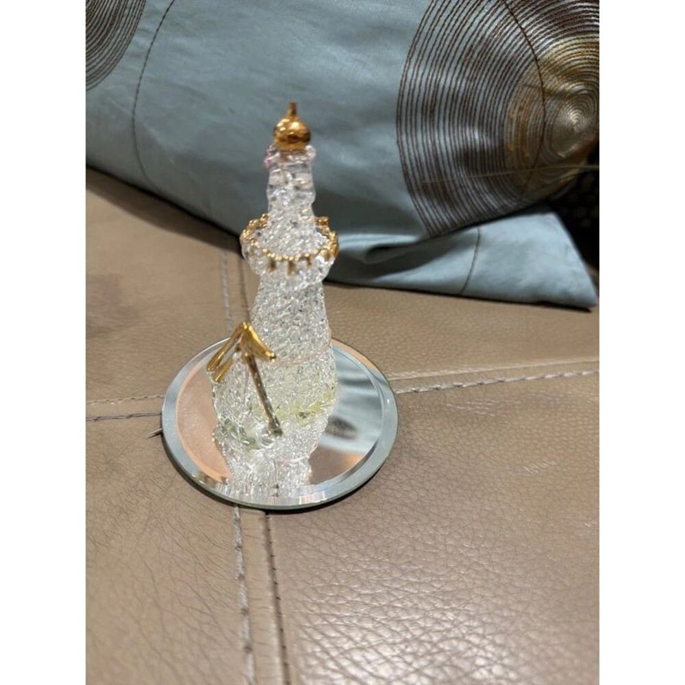 spun glass tower figurine with gold-tone accents